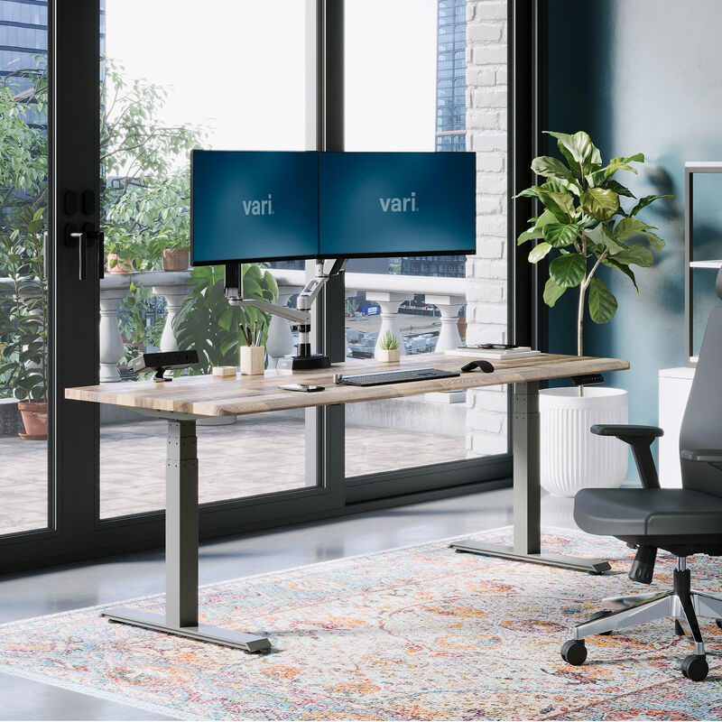 Electric Standing Desk with ComfortEdge in 72x30 Reclaimed Wood in lowered position at home image number null